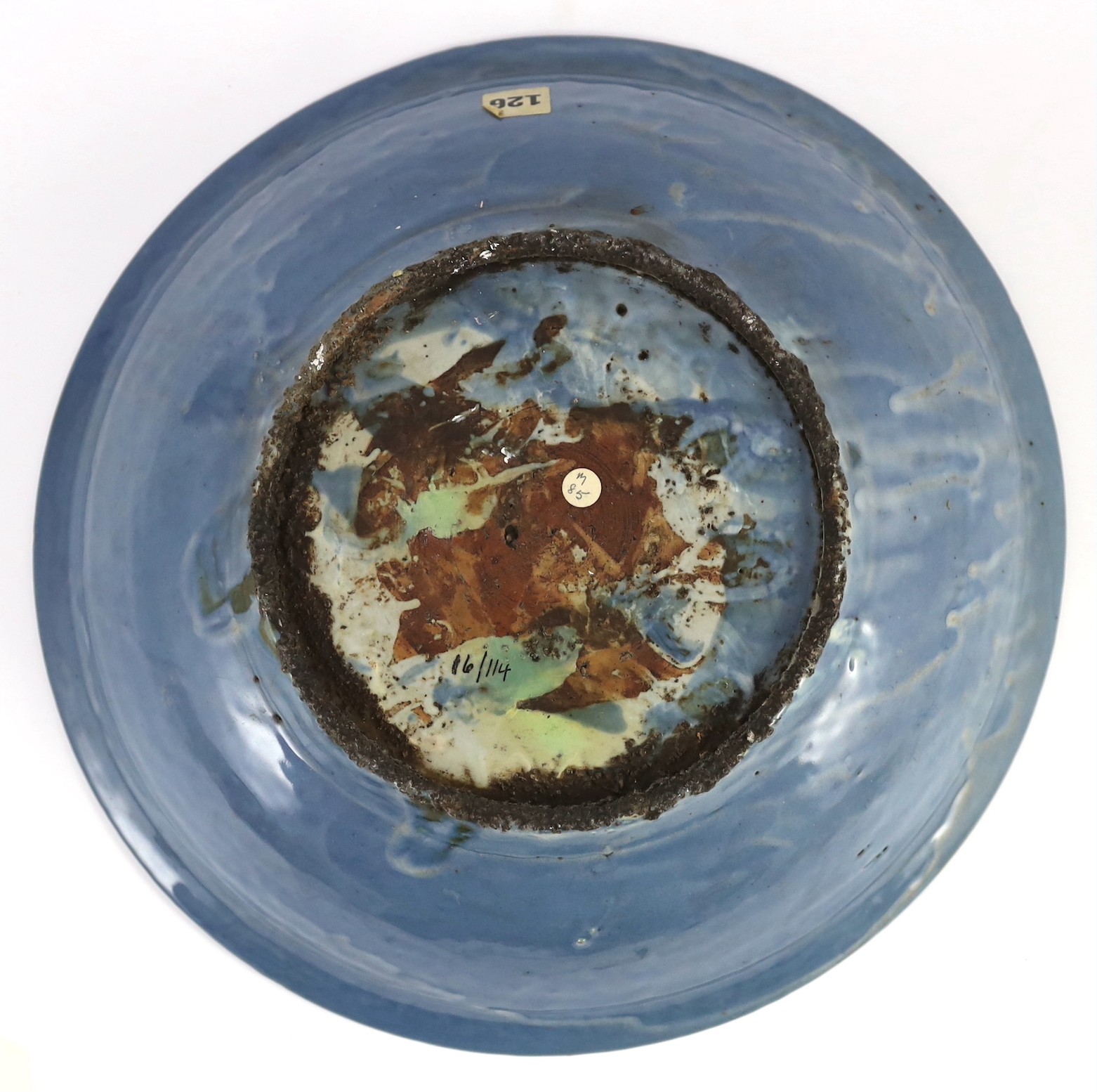 A Chinese Swatow slip-decorated blue glazed deep dish, Zhangzhou kilns, early 17th century, 38cm wide, crack to base